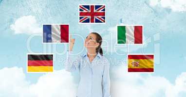 Businesswoman watching differents flags above her