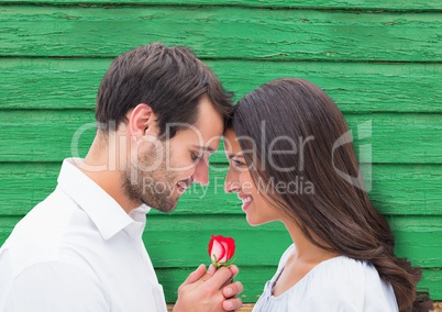 couple with flower with green wood background