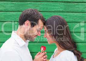 couple with flower with green wood background