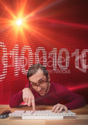 Hipster man taping on a keyboard in front of red digital screen