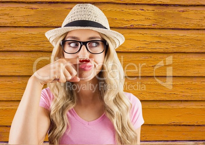 hipster woman with glasses with yellow  wood background