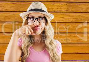 hipster woman with glasses with yellow  wood background