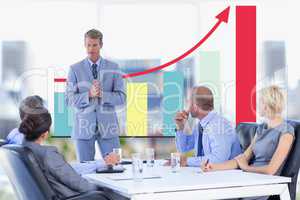 Business meeting in front of digital screen with graphics
