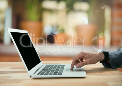 Businessman on laptop in cozy warm room