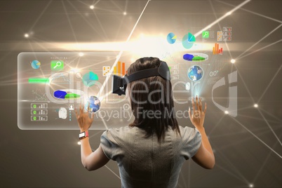 Woman watching digital screens with virtual glasses