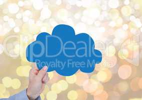 Hand holding cloud with sparkling light bokeh background