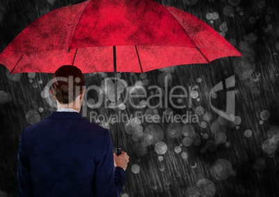 Back of business woman with umbrella against bokeh with grunge overlay