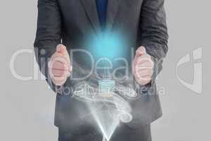 bulb on hands against grey background