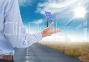 solar panel on businessman hand in the road