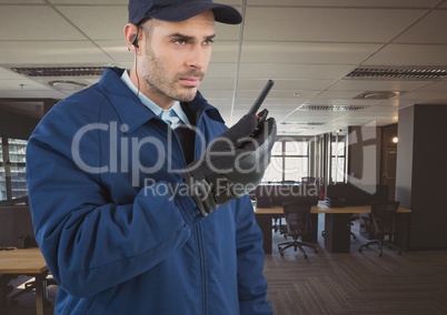 security guard with walkie-talkie and headphone in the office