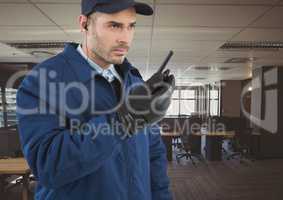 security guard with walkie-talkie and headphone in the office