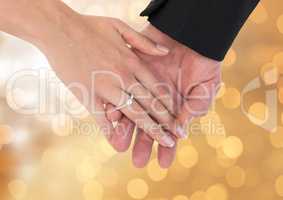 Couple Hands with ring wedding engagement with sparkling light bokeh background
