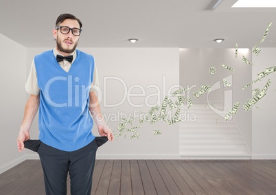 Portrait of businessman standing in office building with empty pockets representing loss of money