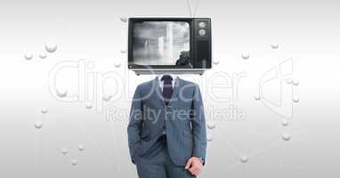 Businessman with TV on face standing against abstract background