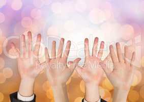 Many open Hands with sparkling light bokeh background