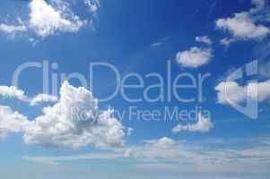 blue sky and cumulus clouds