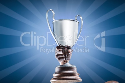 Hand holding a digital trophy with blue background