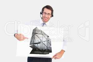 Businessman with hands free kit holding plans