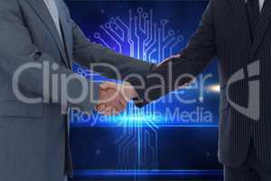 Businessmen shaking their hands with digital background