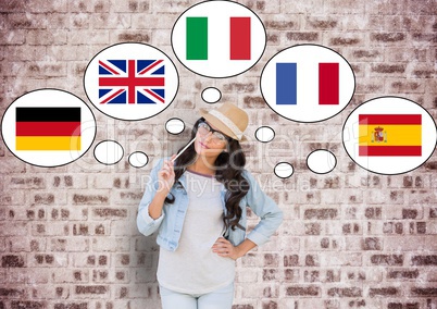 young happy woman thinking in main languages. Bricks wall background