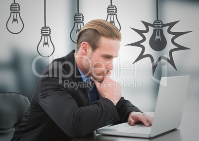 Business man thinking at laptop against blurry grey office with grey lightbulb graphics