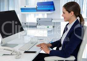 Businesswoman on computer at desk