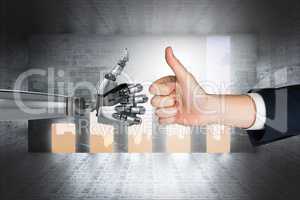 human hand touching robot hand against graphics background