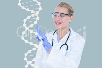 Medical models touching DNA graphics against blue background