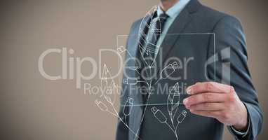 Business man mid section with glass device and white leaf doodle against brown background