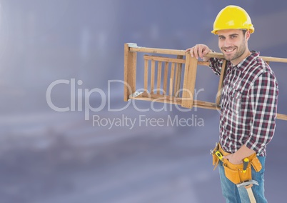 Construction Worker with ladder in front of construction site