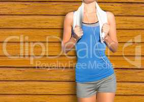 fitness  woman with towel with yellow wood background