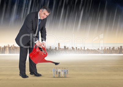 Digital composite image of businessman watering business people in rain against city