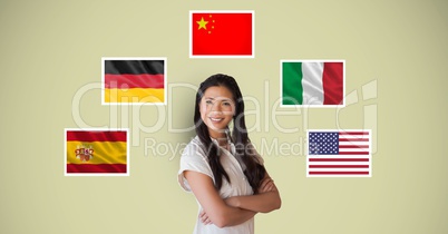 Portrait of beautiful woman smiling with arms crossed standing by flags