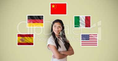 Portrait of beautiful woman smiling with arms crossed standing by flags