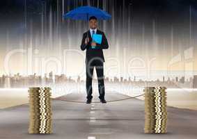 Digital composite image of businessman holding blue umbrella balancing on rope amidst stack of coins