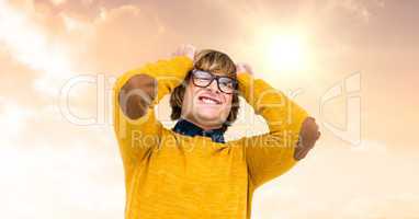 Frustrated young man with hand in head standing against cloudy sky