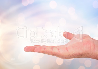 Hand open with sparkling light bokeh background