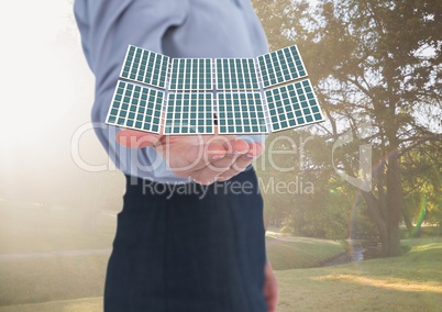 solar panel on businesswoman hand in the park