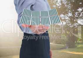 solar panel on businesswoman hand in the park