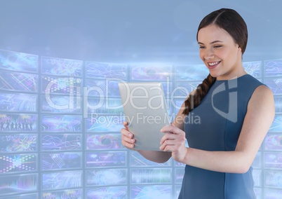 Businesswoman holding tablet with colourful blue screen visuals