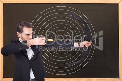 Businessman playing archery