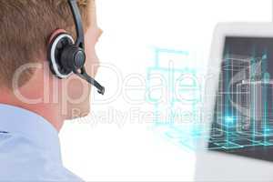Man with headphones watching a screen with digital graphics