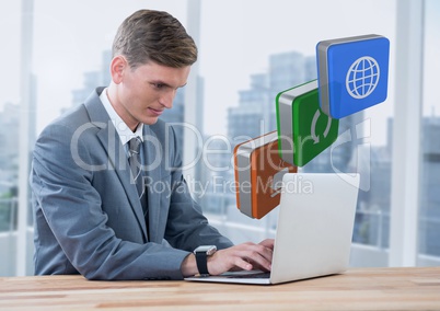 Businessman on laptop with apps icons against windows with city
