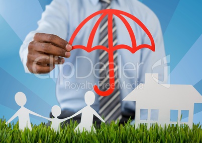 Holding umbrella over insurance cut outs home family