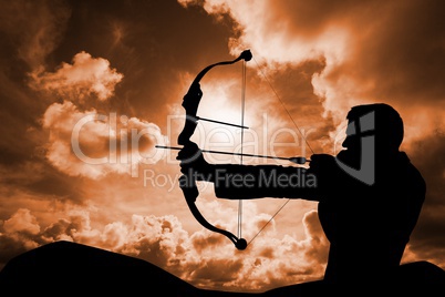 Archery player in front of cloudy background