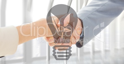 Close up of handshake with grey lightbulb graphic