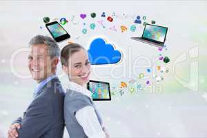 Businessman and business woman, back to back, are smiling against digital icons background