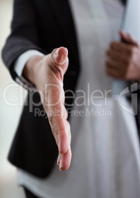 businesswoman giving hand to handshake