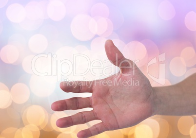 Hand open with sparkling light bokeh background