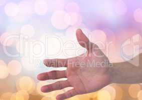 Hand open with sparkling light bokeh background